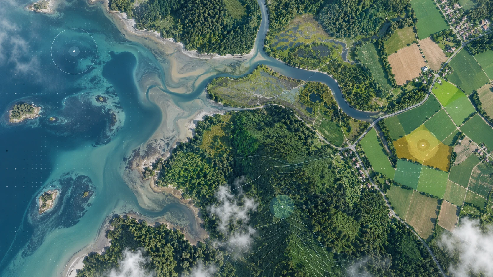 Aerial survey of an estuary and surrounding farmland with analytical overlays marking monitored zones